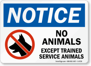 A sign notifying business patrons that no animals are allowed inside except for trained service animals.