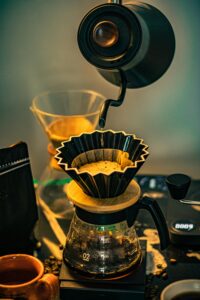 High-quality image of pour-over coffee brewing in a cozy café setting, capturing the art of coffee making.
