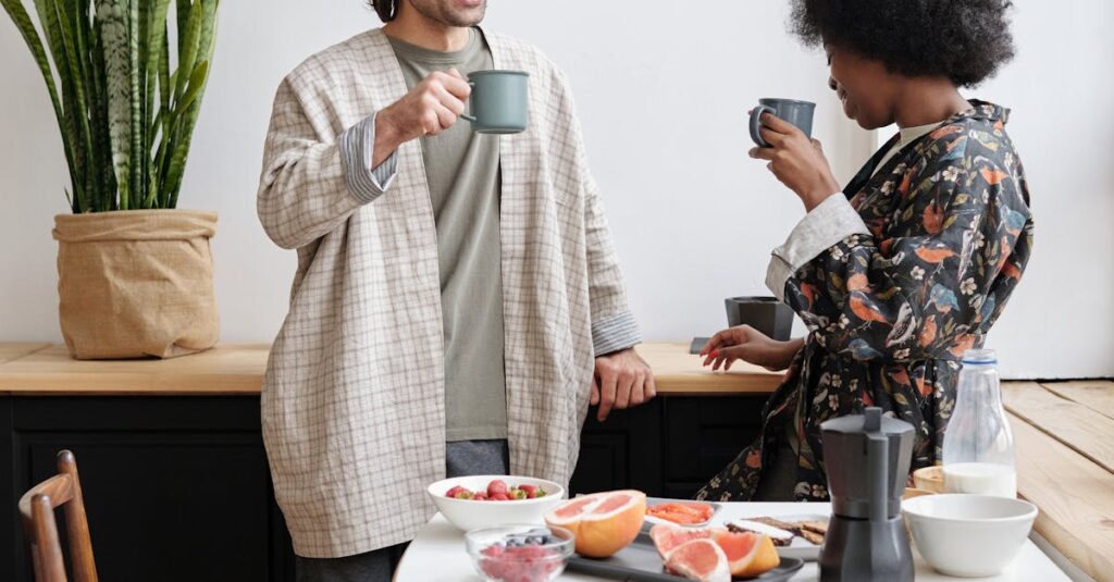 A cheerful couple enjoying morning coffee together with a healthy breakfast and cozy atmosphere.