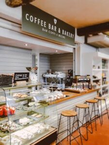 Inviting indoor scene of a bakery cafe with pastries and seating.